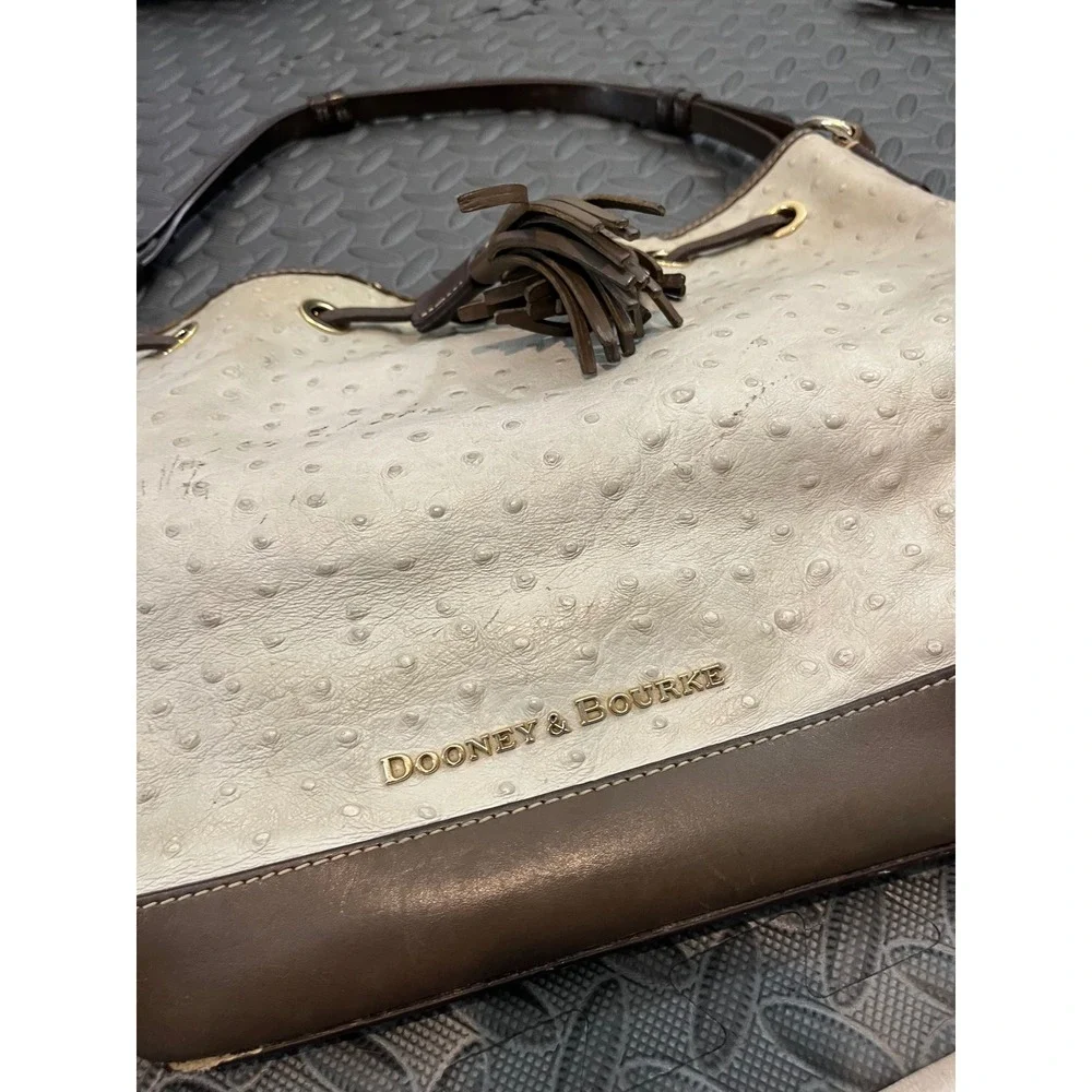 Dooney & Bourke Bucket Bag Womens Medium Cream Brown Ostrich Embossed Tassel